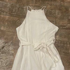 Worn 1x Sz  Xs/S white jumpsuit. Tag says S ,also fit Xs due to measurements.